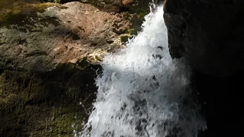 Water from a waterfall is moving between rocks (slow motion) Stock Footage 219418738