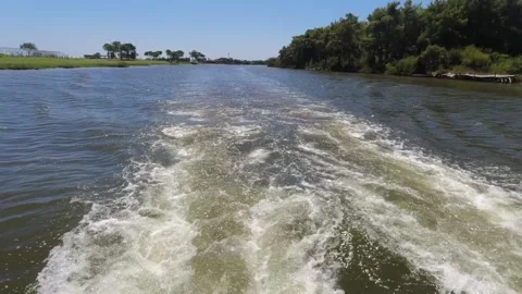 Water wave river trail from the engine at the stern of the boat Stock Footage 165551009