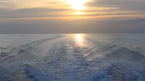 Water waves background at sunset . View from a moving boat Stock Footage 37649745