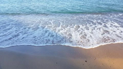 Water waves on the beach from above Stock Photos