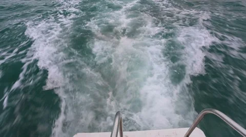Water waves behind the boat Stock Footage 55860069