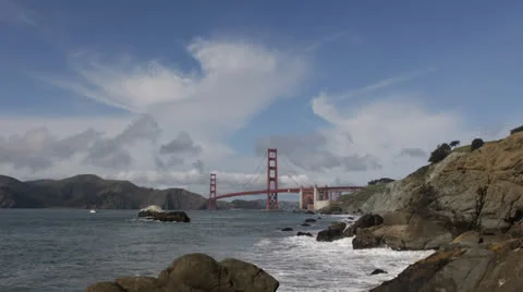 Water waves breaking Coast Rocks, Famous Golden Gate Bridge, San Francisco Bay Stock Footage 24812328