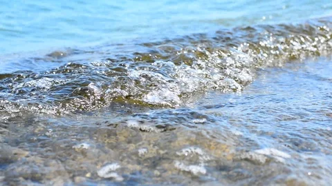 Water waves on flat stone. Stock Footage 91804297