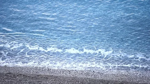Water waves on stone beach Stock Footage 71444136