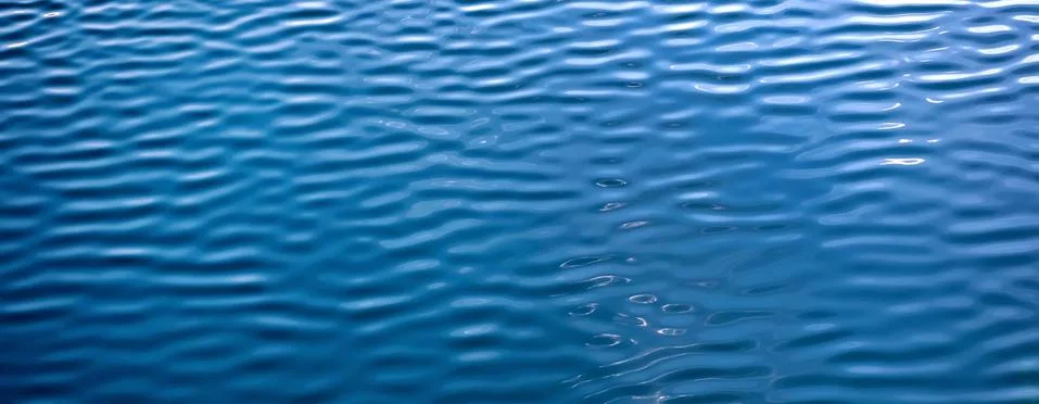 Water Waves Surface as Background. Light ripples in the water. Beautiful abst Foto stock