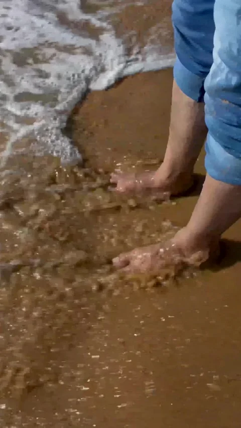 Water waves touching the human legs and feet in the Ocean front. Stock Footage 320438857