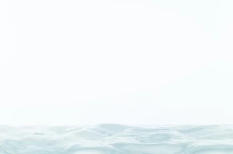 Water waves in a white background Stock Photos