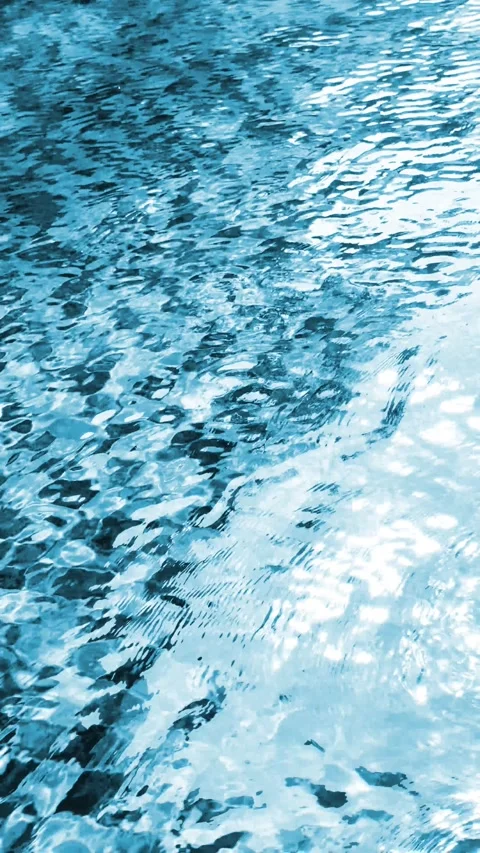 Water waving with light reflection in swimming pool Summer background Stock Footage 339426564