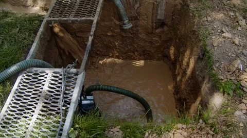 Water well drilling process in a rural area with equipment setup Vidéo 336792585