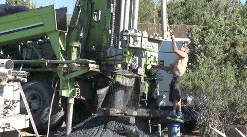 Water Well  Drilling Rig With Operator setting up Stock Footage 38212618