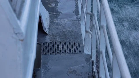 Water wetting the deck of a catamaran and moving chain Stock Footage 126839809