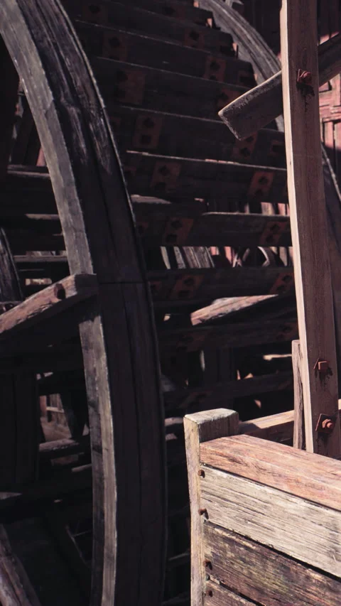Water wheel turning in an old mill in the countryside during the day Stock Footage 342166405