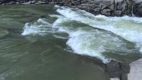 The water of a wild mountain river splashes on a summer day. Stock Footage 251536820