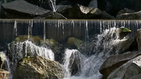 Water on a wild waterfall flows down the rocks Video stock 80537959