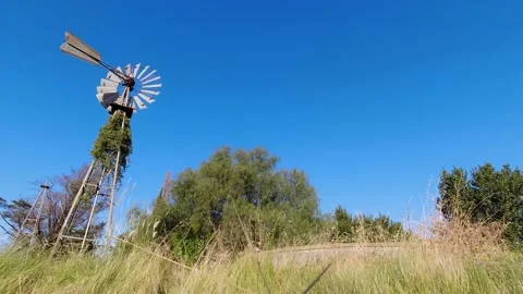 Water windmill on blue sky Stock Footage 168710599