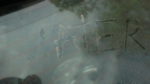 "WATER" WRITTEN IN DIRT ON CAR WINDOW Stock Footage 59864324