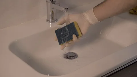 Water on a yellow sponge - slow motion Stock Footage 125524152