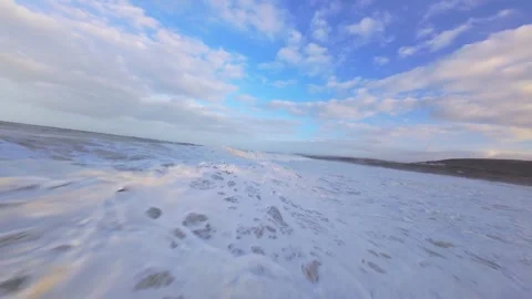 Watercraft perspective shows foamy waves washing ashore Stock Footage 344677332