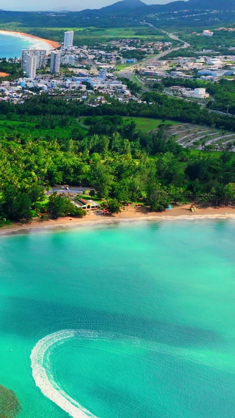Watercraft wake forming loop in coastal bay, Puerto Rico Vertical video. Stock Footage 342274070