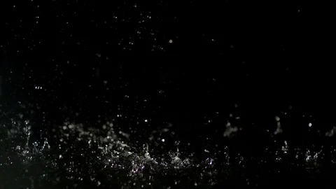 Waterdrops falling against black background in slow motion Stock Footage 81311441