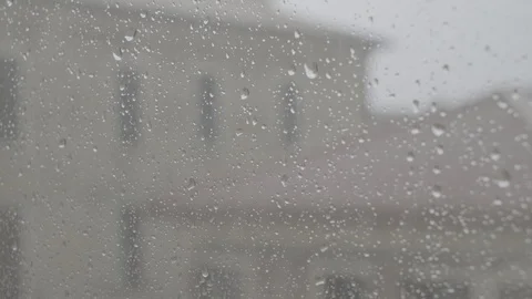Waterdrops Falling in a Rainy Day on a Window Stock Footage