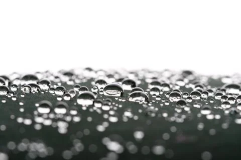 Waterdrops on gray surface Stock Photos