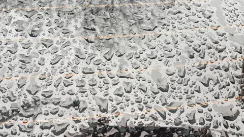 Waterdrops on a grey surface Stock Photos