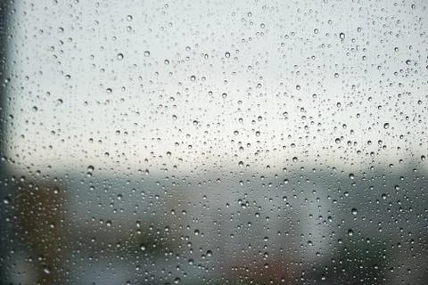 Waterdrops on the window. Close-up. Stock Photos