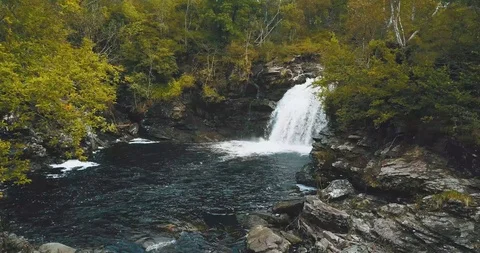 Waterfall aerial 4k linear drone shot faded film effect Video stock 126733331
