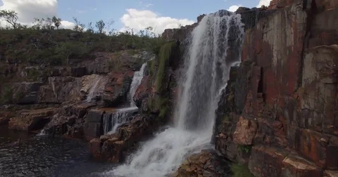 Waterfall aerial: camera pans round moving backwards to reveal waterfall 스톡 동영상 69720140