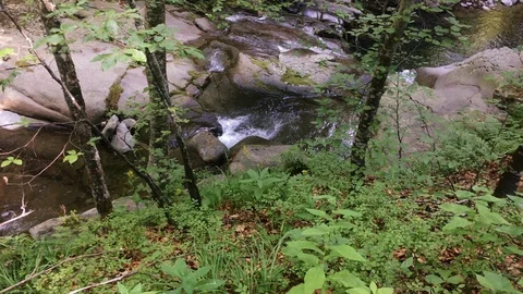 Waterfall along the creek Stock Footage 99965382