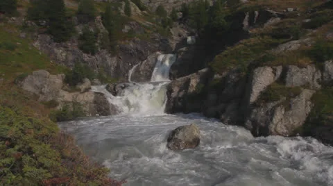 Waterfall in Alps Forest Stock Footage 23569038