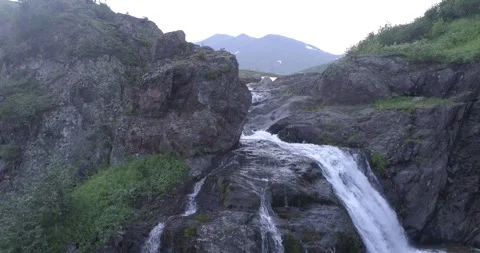 Waterfall among the big rocks in the Ural mountains. Camera moves down Stock Footage 269540139