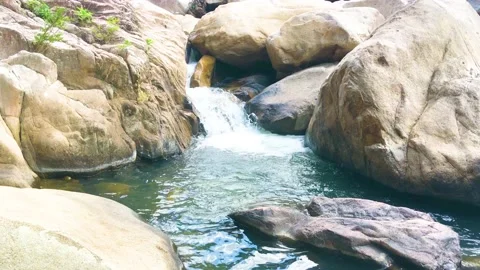 Waterfall among boulders Video stock 194309171