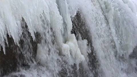 Waterfall among ice on the river in spring Stock Footage 88395070