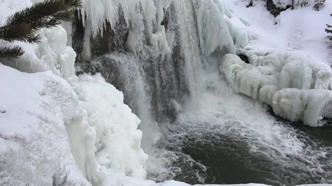 Waterfall among ice on the river in spring Stock Footage 88395109