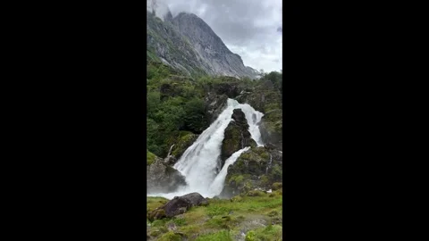 Waterfall among rocks and mountains Stock Footage 337364603