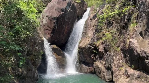 Waterfall among the rocks Stock Footage 185529517