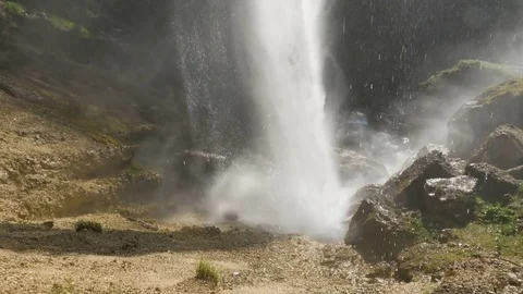 Waterfall and bright sunlight in forest Stock Footage 71568182