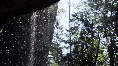 Waterfall and bright sunlight in slow motion Stock Footage 71568016