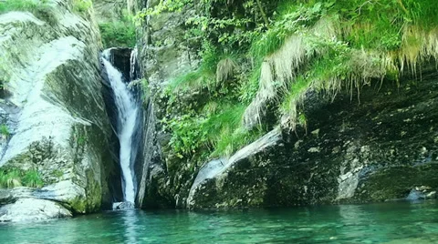 Waterfall and brook in the alps. Video stock 32452547