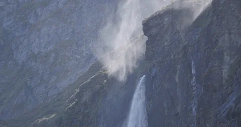 Waterfall and floating mist in sunlight Stock Footage 119552436