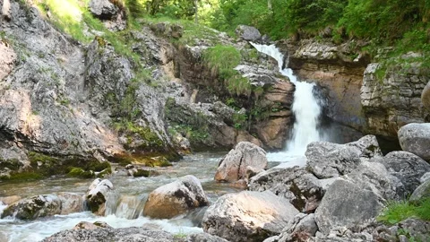 A waterfall and a mountain stream with nice stones Stock-Footage 219351514