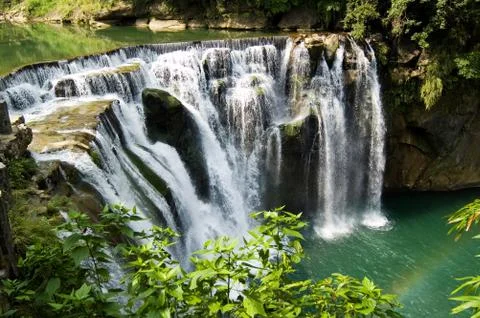 Waterfall and rainbow Fotos Stock