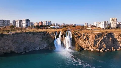 Waterfall and rainbow. Waterfall pouring into the sea in Antalya Stock Footage 240030716