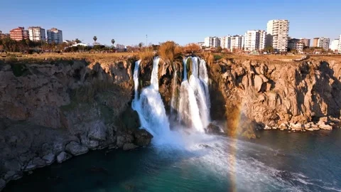 Waterfall and rainbow. Waterfall pouring into the sea in Antalya Stock Footage 240030812