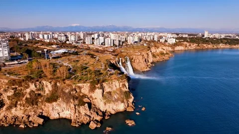 Waterfall and rainbow. Waterfall pouring into the sea in Antalya Stock Footage 240030830