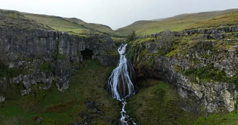 Waterfall and river on the hillside Stock Footage 276185692