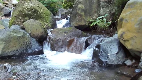 Waterfall and river stream on the mountain on rahtawu Video stock 124682099