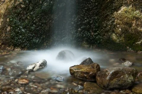 Waterfall and rocks Stock Photos